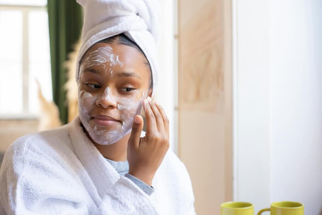 woman applying a face mask