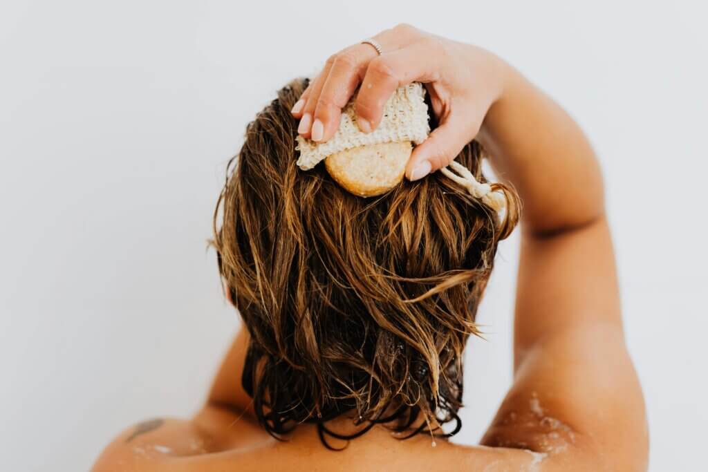 a woman washing her hair